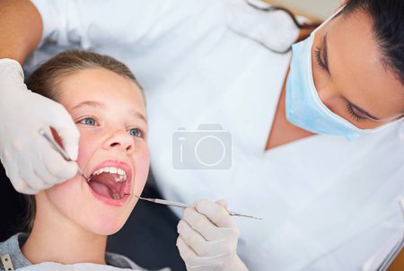 Photo for Dental mirror, girl or woman dentist with teeth exam, tooth cavity or gum disease, bacteria or search. Oral, wellness or female doctor with tool for pediatric dentistry, cleaning or mouth inspection. - Royalty Free Image