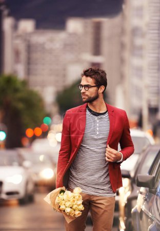 Photo for Man, street and walk with bouquet in city outdoor with style, fashion and outfit for date night. Confident, road and urban in elegant clothes or flowers with blazer in downtown for classy look. - Royalty Free Image