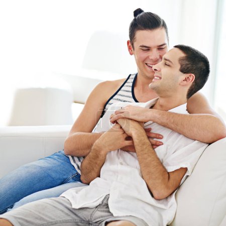 Photo for Men, gay and happy couple embrace in home with bonding connection or queer pride as homosexual, love or comfort. Male people, smile and laughing joke in apartment for relationship, marriage or rest. - Royalty Free Image