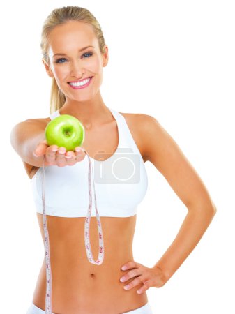 Photo for Portrait, happy and woman with measuring tape, apple or offer on studio white background. Face, smile or lady model with fruit, deal or invitation to gut health guide, detox or diet nutrition balance. - Royalty Free Image
