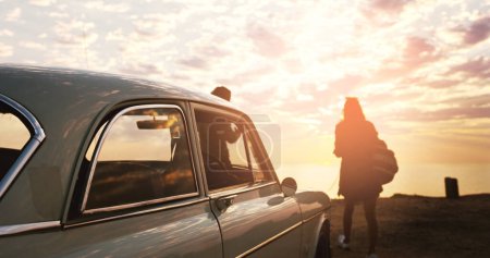 Photo for Couple, road trip and car with back, sunset and beach for memory, vacation and outdoor in nature. People, silhouette and vehicle for transportation, travel and holiday in summer sunshine by ocean. - Royalty Free Image