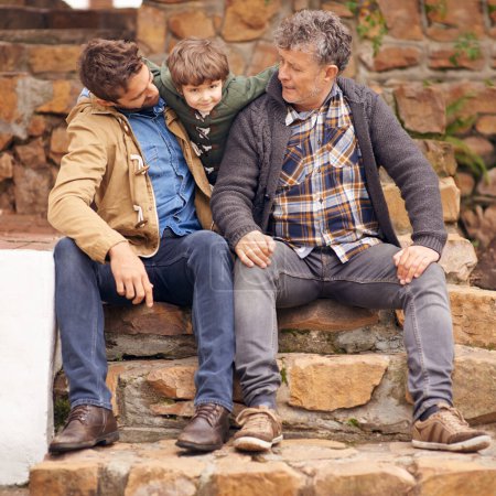 Photo for Child, father and portrait of grandfather outdoor at steps for bonding, care or relax together for love. Family, kid and dad with grandpa, generations and parent embrace boy for healthy support. - Royalty Free Image