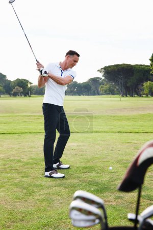 Photo for Man, golfer and swing with club on golf course for game, match or outdoor sport on green grass or field in nature. Male person or player hitting ball on lawn for hole, competition or down the fairway. - Royalty Free Image