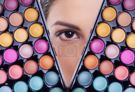 Photo for Beauty, makeup palette and eye of woman in studio for cosmetics, powder and foundation on background. Closeup, skincare and portrait of model with cosmetology product, facial glow and eyeshadow. - Royalty Free Image