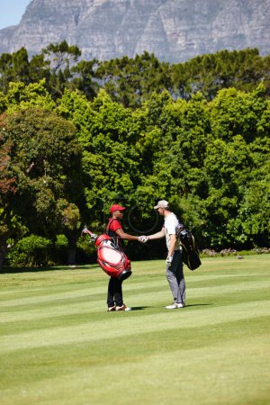 Photo for Man, friends and golfer with handshake for meeting, game or match together on grass field in nature. Male person, people or sports player shaking hands for teamwork, deal or agreement on golf course. - Royalty Free Image