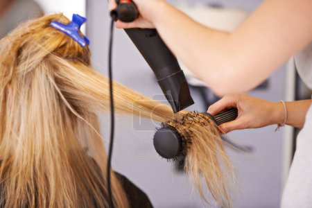 Photo for Brush, hair and hands with dryer for beauty, people at hairdresser for haircare and maintenance with heat treatment. Electric appliance, styling and blow drying for makeover with cosmetic care. - Royalty Free Image