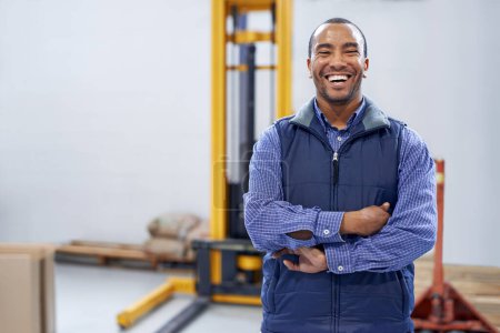 Photo for Man, smile and portrait in factory for production process, industry and manufacturing for distribution. African person or worker and happy with forklift for stock and supply for service and work. - Royalty Free Image