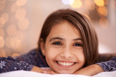 Photo for Kids, portrait and happy girl relax in a house for vacation, resting or break with light and bokeh background. Face, smile and innocent female child person in a living room for holiday or weekend. - Royalty Free Image