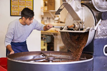 Coffee, cafe and man with machine for roasting with blending, production and quality control. Entrepreneur, barista or roaster with beans at small business, sustainable startup and espresso process.