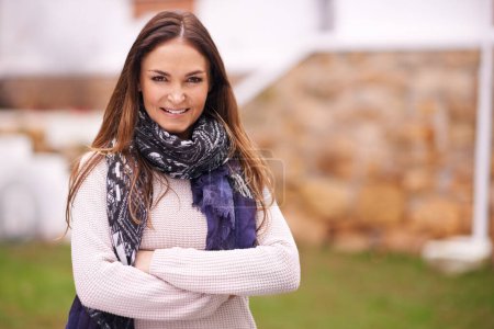 Photo for Outdoor, portrait and woman with arms crossed in fashion for winter in backyard or garden of home. Girl, smile and confidence on holiday or vacation with casual style, happiness and relax with pride. - Royalty Free Image