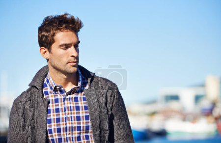Photo for Harbor, outdoor and man on travel for vacation, adventure or holiday with memory or reflection. Ideas, nature and male person by sea port on weekend trip in Cape Town with thinking face expression - Royalty Free Image
