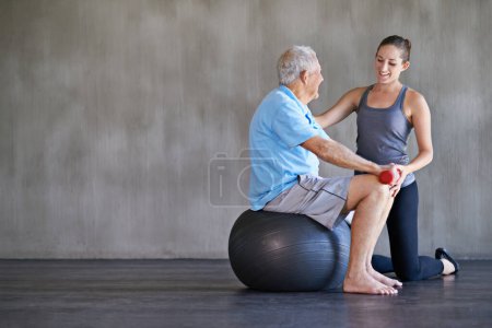 Photo for Physiotherapist, dumbbells and happy elderly man on ball for fitness or rehabilitation at gym on mockup. Senior person, weightlifting and personal trainer help for body health or physical therapy. - Royalty Free Image
