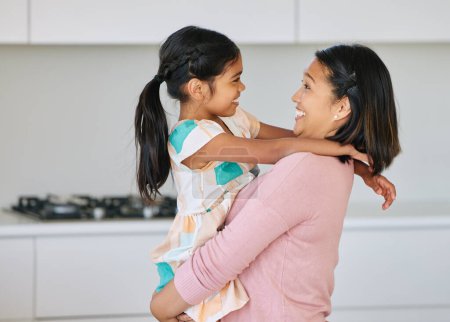 Photo for Asian mom, girl and happy with bonding in kitchen for support, love and growth or child development. Parent, kid and smile at home as family, childhood memories and fun together with care and trust. - Royalty Free Image