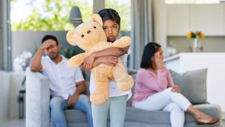 Photo for Couple, fighting and sad in child home, living room and girl with teddy bear for support and comfort in family conflict. Parents, divorce and marriage problems, childhood trauma and disagreement. - Royalty Free Image