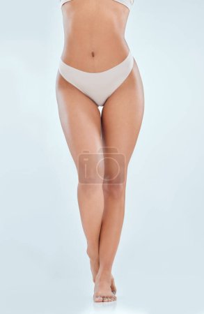 Photo for Legs, studio and woman in underwear for beauty, skincare and grooming on white background. Cosmetic, shave or epilation for hair removal on female model, treatment and dermatology for hygiene care. - Royalty Free Image