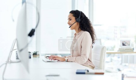 Photo for Call center, computer and happy consultant woman in telemarketing office for online assistance or help. Contact us, desk and microphone with sales agent or operator in workplace for customer support. - Royalty Free Image