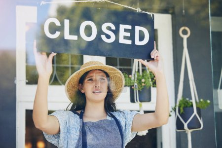 Photo for Closed, woman and floral business with sign, recession and inflation with bankruptcy, emotion and failure. Person, entrepreneur or worker with unemployment, stagflation or stress with store or upset. - Royalty Free Image