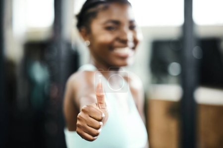 Photo for Fitness, thumbs up and portrait of black woman in gym for cardio, performance training or successful workout. Instructor, hand gesture and female person for achievement, satisfaction or motivation. - Royalty Free Image