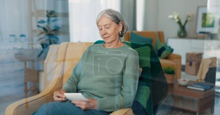 Photo for Elderly woman, photograph and retirement in nursing home with memory, relax with history for nostalgia and think about life. Remember, past and old age with pension, retro picture and rest in lounge. - Royalty Free Image