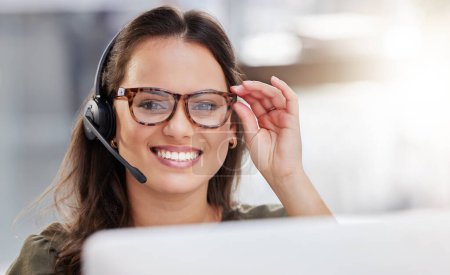 Photo for Agent, portrait and online technical support in call center with woman at computer to help or chat. Happy, consultant and contact us for telecom customer care, advice or virtual feedback with tech. - Royalty Free Image