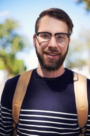 Photo for Man, portrait and university student in outdoors, smile and morning commute to college. Happy male person, backpack and campus for learning or education, knowledge and ready for course and confident. - Royalty Free Image
