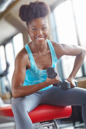 Photo for Fitness, portrait or black woman with dumbbells in training, workout or exercise for grip strength. Bodybuilder, bodybuilding or happy athlete with weights for energy, challenge or balance in gym. - Royalty Free Image
