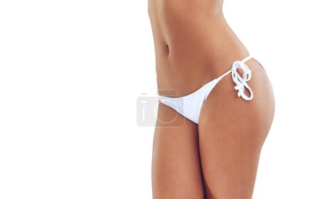 Photo for Fitness, bikini and tummy of woman in studio for skincare, beauty and health on white background. Wellness, closeup and isolated person in swimsuit, underwear and swimwear for holiday or vacation. - Royalty Free Image