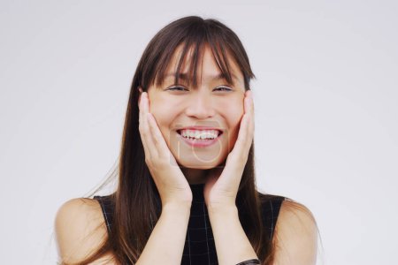 Photo for Happy, surprise and portrait of woman in studio for good news, compliment or announcement. Asian person, smile and hands with reaction for prize, information or notification on white background. - Royalty Free Image