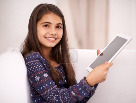Photo for Portrait, smile or child with tablet for streaming, playing games or watching fun videos on movie website. Relax, house or happy kid with technology to download on social media app on screen on sofa. - Royalty Free Image