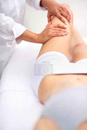 Photo for Woman, spa and leg massage for skincare, health and physical therapy for wellbeing break. Lady, detox and muscle treatment for body care, stress relief and zen for peaceful beauty or wellness. - Royalty Free Image