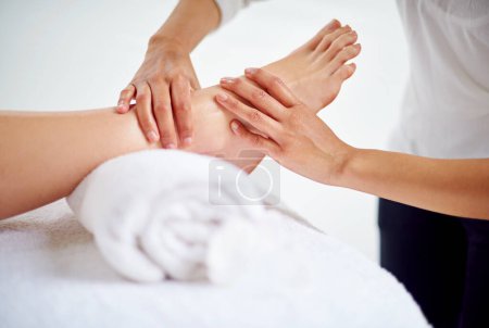 Photo for Woman, feet and massage table in spa, therapy and self care for body wellness and resting for tension. Comfortable and resort with client, stress free and healing, calm session and cosmetology. - Royalty Free Image