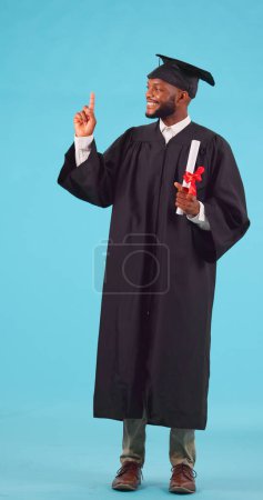 Photo for Marketing, presentation and man graduate with diploma in studio for achievement or goal success. Graduation, advertising and portrait of African male university student with degree by blue background. - Royalty Free Image