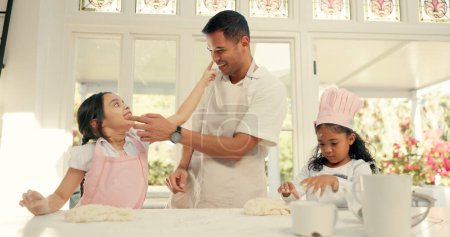 Photo for Baking, dough and a father teaching his girls about cooking in the kitchen of their home together. Pastry, children or family with kids learning about food from from a man parent in the house. - Royalty Free Image