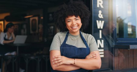 Photo for Happy black woman, cafe and owner by door of small business in confidence for management. Portrait of young African female person or waitress smile with arms crossed of professional at coffee shop. - Royalty Free Image