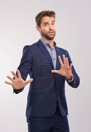 Businessman, hand gesture and studio to refuse or decline business offer with concern on white background. Portrait entrepreneur and reject with move away to deny accusations as corporate person