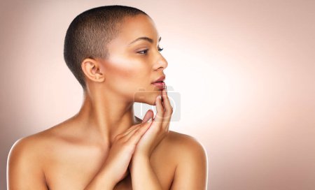 Photo for Profile, woman and studio for skincare, cosmetics and makeup on backdrop. Female person, facial treatment and bald wellness by pink background for beauty, dermatology and foundation for face glow. - Royalty Free Image