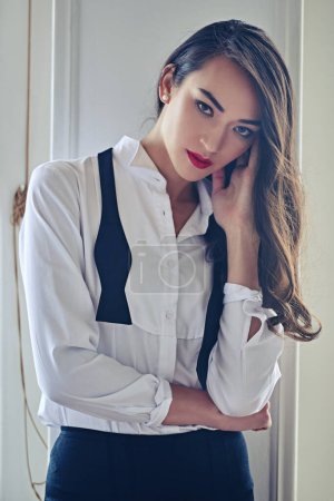 Téléchargez les photos : Beauty, fashion and portrait of woman with confidence in elegant style, classy outfit and formal clothes. Cosmetology, aesthetic and person with red lipstick, cosmetics and serious attitude in home. - en image libre de droit