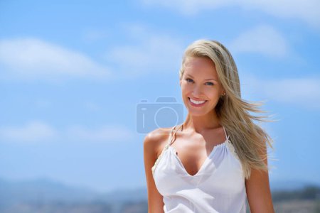 Photo for Portrait, sky or happy woman at a beach to relax on vacation for break at sea in Athens, Greece. Tourist, ocean or person in summer fashion or clothes to travel with smile, wellness or confidence. - Royalty Free Image