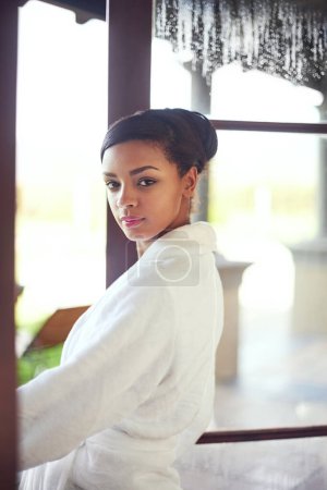 Photo for Woman, portrait and bathrobe in hotel room at window for morning relax or spa resort, hospitality or traveling. Female person, face and accommodation in Bali for vacation travel, holiday or open door. - Royalty Free Image