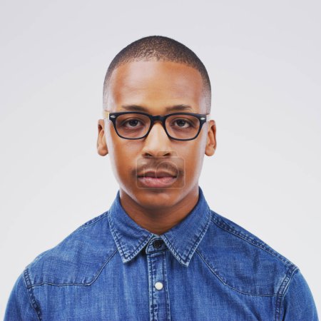 Photo for Portrait, African and man in white background in studio with serious, face and glasses in mockup space. Black, male person and trendy, eyewear and isolated in backdrop for fashion, style and model. - Royalty Free Image