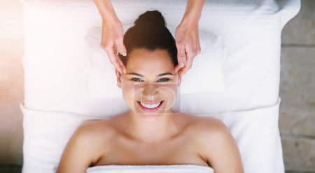 Photo for Happy, salon and portrait of woman at spa for massage, facial treatment and luxury pamper. Aesthetic, dermatology and above of person on bed at resort for wellness, skincare and beauty service. - Royalty Free Image
