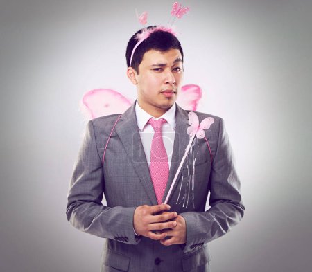 Photo for Business man, fairy costume and portrait with magic in corporate for career growth on grey background. Butterfly, wand and wings, fantasy cosplay for dress up or wish for professional progress. - Royalty Free Image