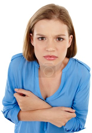 Foto de Angry, portrait and girl in studio with arms crossed top view for mad, emotion and reaction to conflict on white background. Frustrated, face and gen z model annoyed with mistake, crisis or disaster. - Imagen libre de derechos