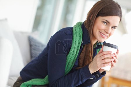 Téléchargez les photos : Woman, portrait and happy with coffee in home for morning routine in winter to warm up and relax for cozy ambiance. Girl, caffeine beverage and indoor bliss in house for contentment and chilling - en image libre de droit