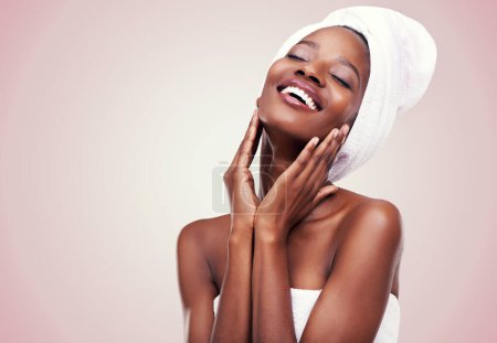 Black woman, skin care and happy for beauty, studio and wellness in fresh look with smile and face touch. African female person, cosmetic, and aloe vera for anti age, nude and natural confidence.