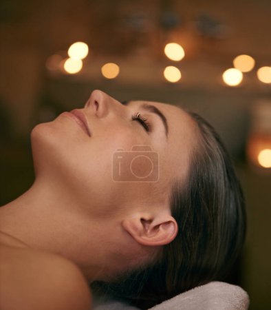 Photo for Woman, spa and candle with luxury, relax and peace with wellness and bokeh. Person, skincare and health for zen, calm and body care at resort or massage parlour and serene ambience and treatment. - Royalty Free Image