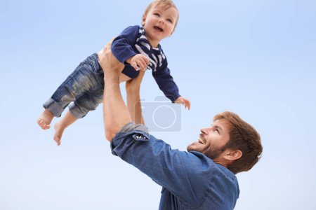 Photo for Happy, baby and smile father lift child with blue sky, family fun for excited kid with love in development and growth. Affection, man play airplane with kid outdoor for quality time game on vacation. - Royalty Free Image