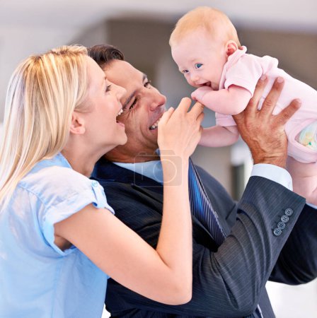 Photo for Family, happy and parents with baby in living room for bonding, affection and childcare at home. Infant, smile and cheerful for interaction with mother, father and healthy relationship in house. - Royalty Free Image