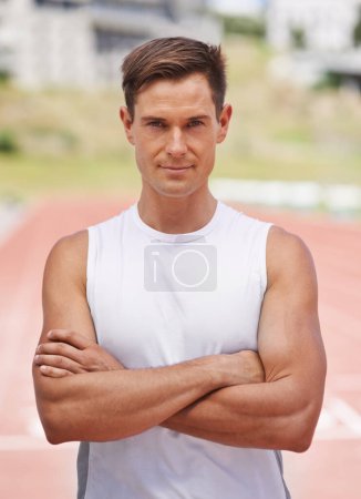 Photo for Athlete, portrait or serious for fitness on stadium, arms crossed or commitment to wellness as running professional. American, man or face for confident in sport, outdoor or training for health body. - Royalty Free Image