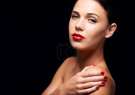 Photo for Woman, beauty and red lipstick in studio, cosmetic and makeup with nail polish for stylish, elegant and edgy model. Cosmetology for female person with spa manicure, skincare with vibrant colour. - Royalty Free Image